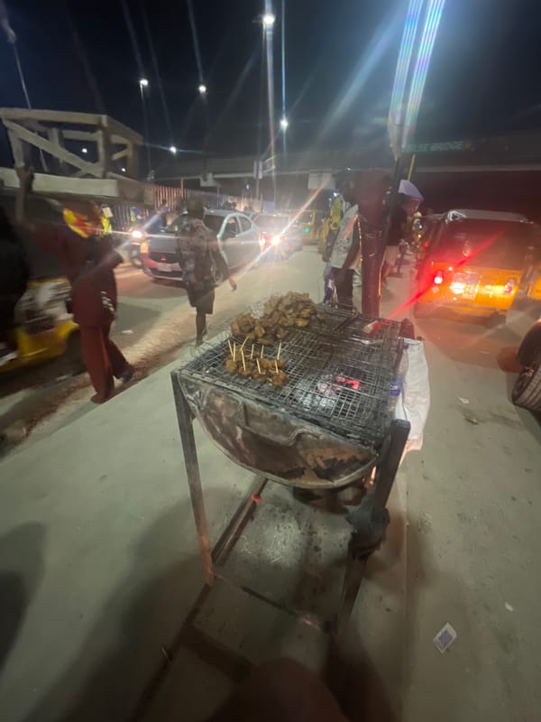 Night suya vendors serve grilled meat at Lagos street stall