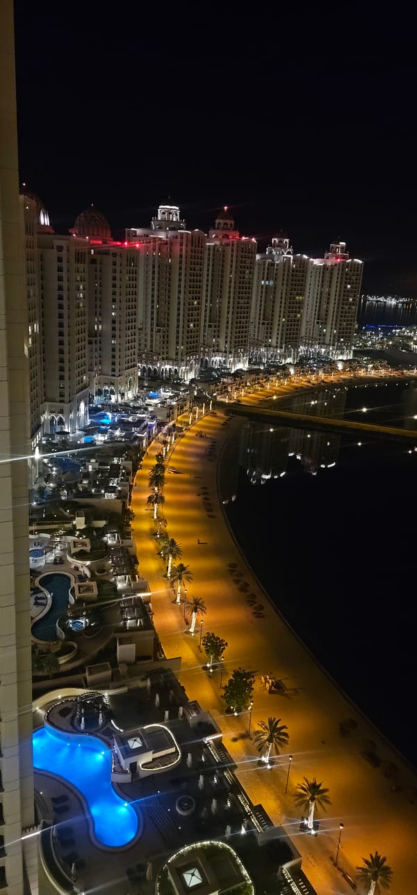 Aerial night views over The Pearl-Qatar's waterfront towers
