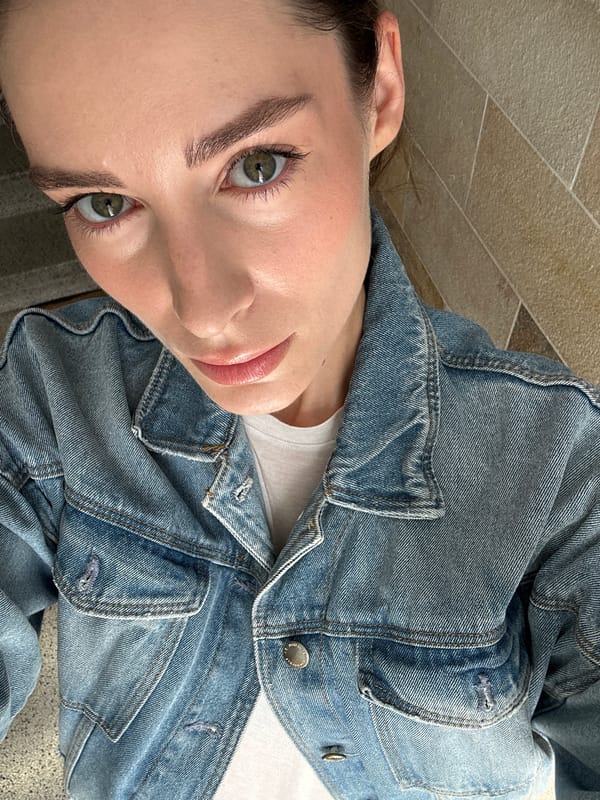 Woman takes multiple selfies around Kiel, Germany
