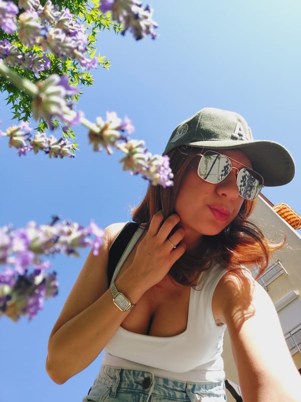 Casual balcony portrait session in Sofia, cap and shades throughout