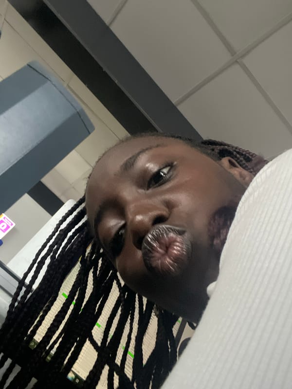 Woman photographed at office workspace in Karum, Nigeria