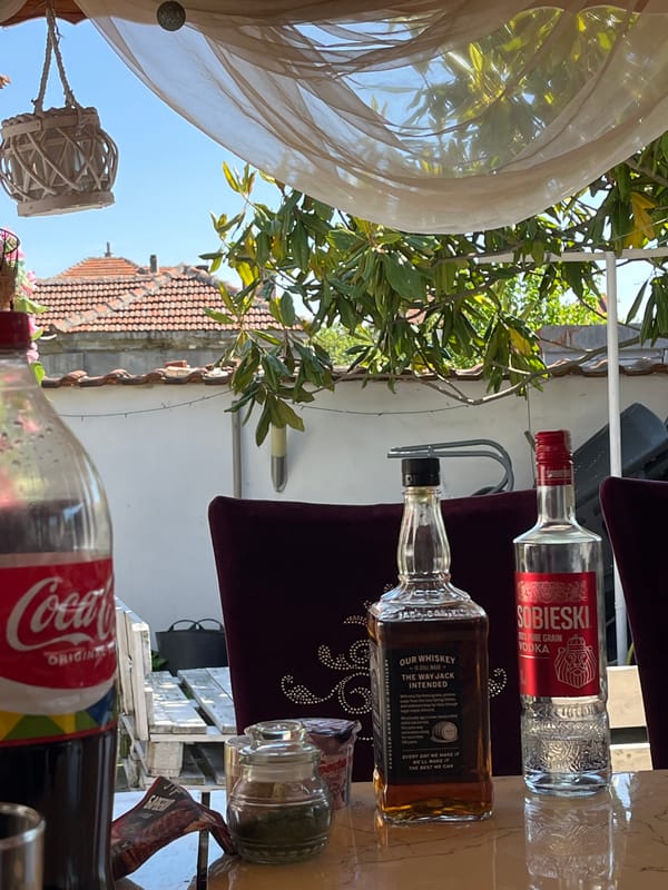 Outdoor table with drinks and decorations observed
