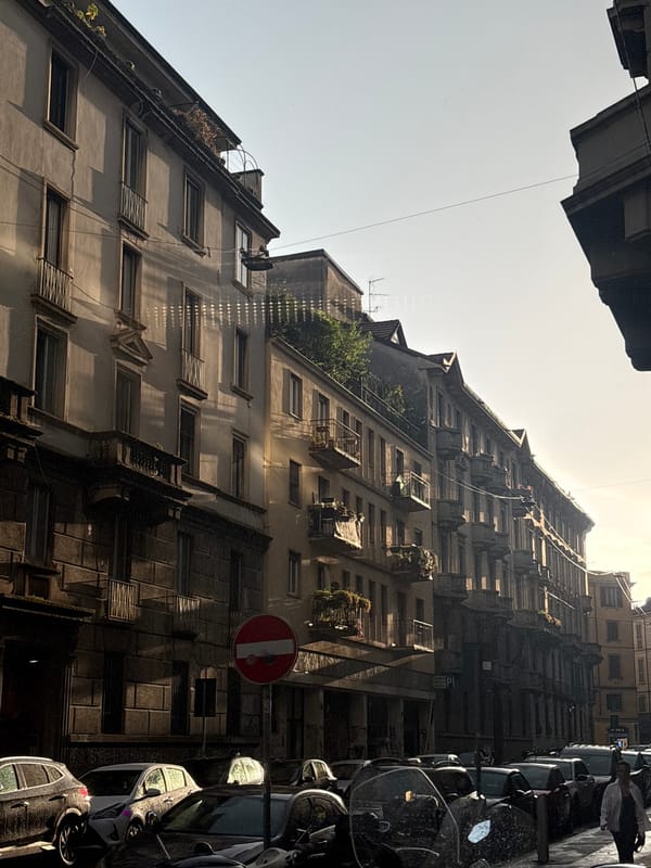Milan residential street showing classic multi-story apartment architecture