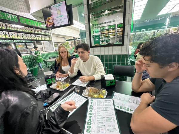 Four diners gather at Mexico City taco restaurant