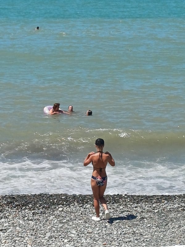 Sochi's Black Sea beach buzzing on a sunny summer morning