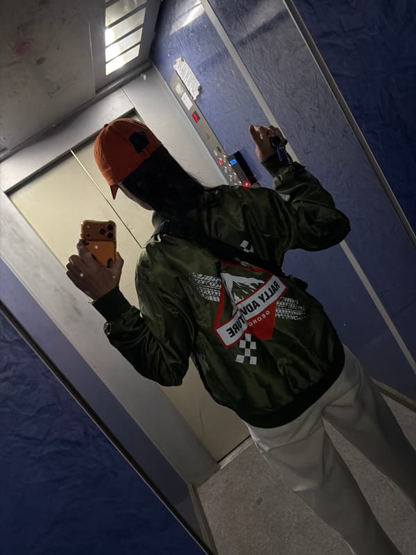 Person takes elevator selfie in Tbilisi wearing colorful outfit