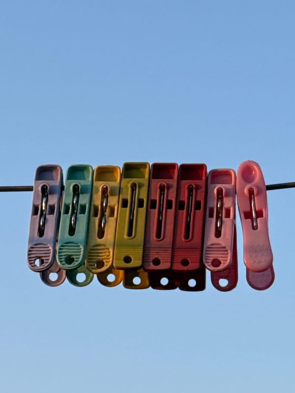 Colorful clothespins stacked on wire observed in Pokhara