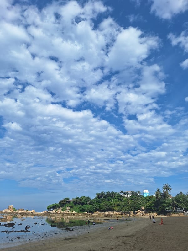 Nha Trang coastline and city streets on a partly cloudy morning