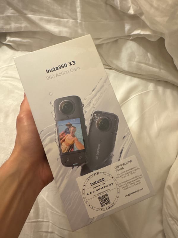 Person holds new action camera box in Bodrum bedroom