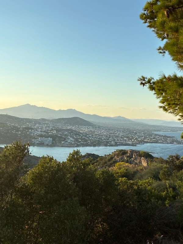 Golden hour over the hills and coast of Limenas Markopoulou