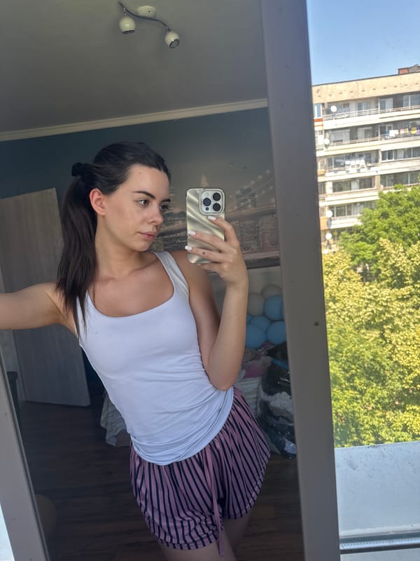 Woman documents selfie session ending with chocolate cake