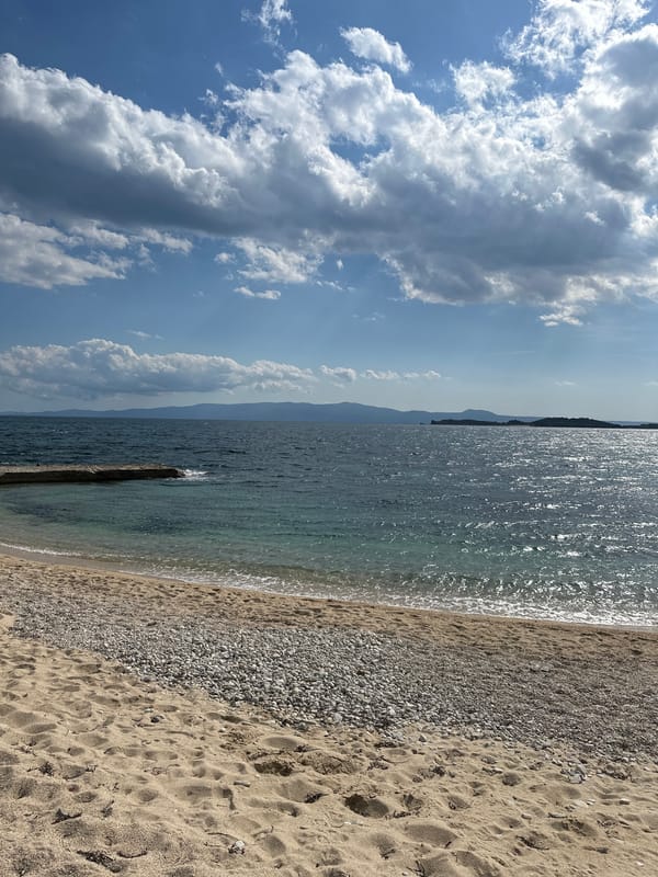 Tourist takes selfie at Greek beach in Ouranoupoli