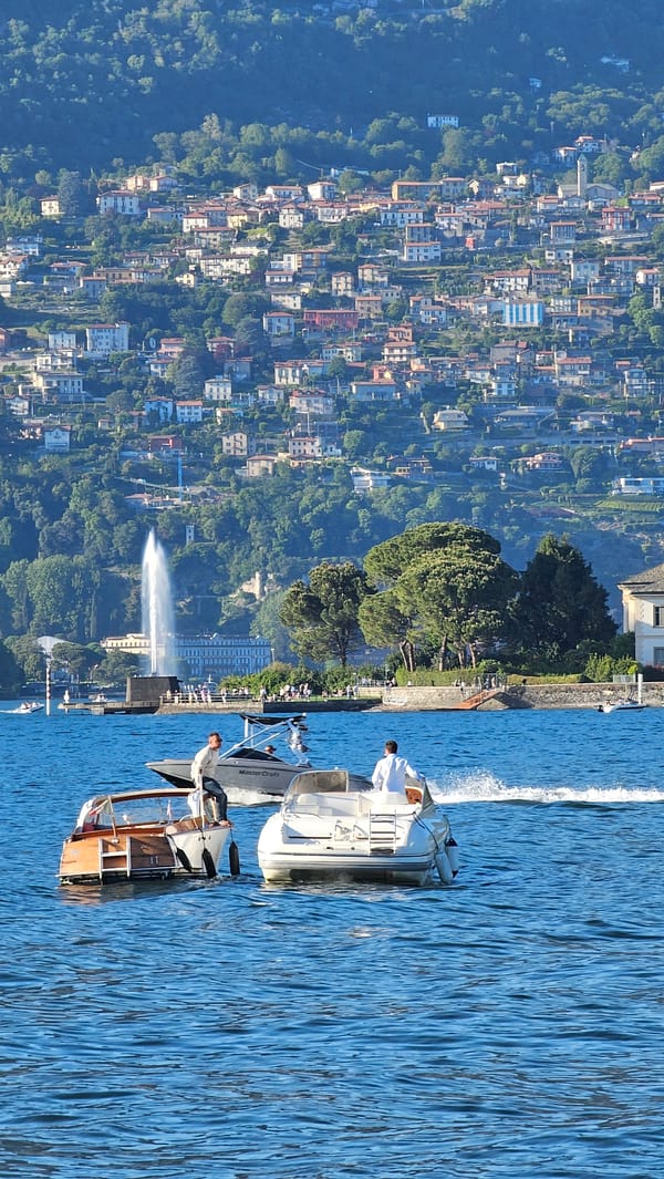Boats spotted on sunny Lake Como afternoon