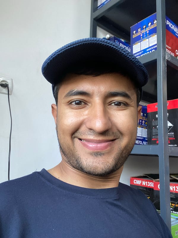 Man takes selfies at automotive store in Bukhara