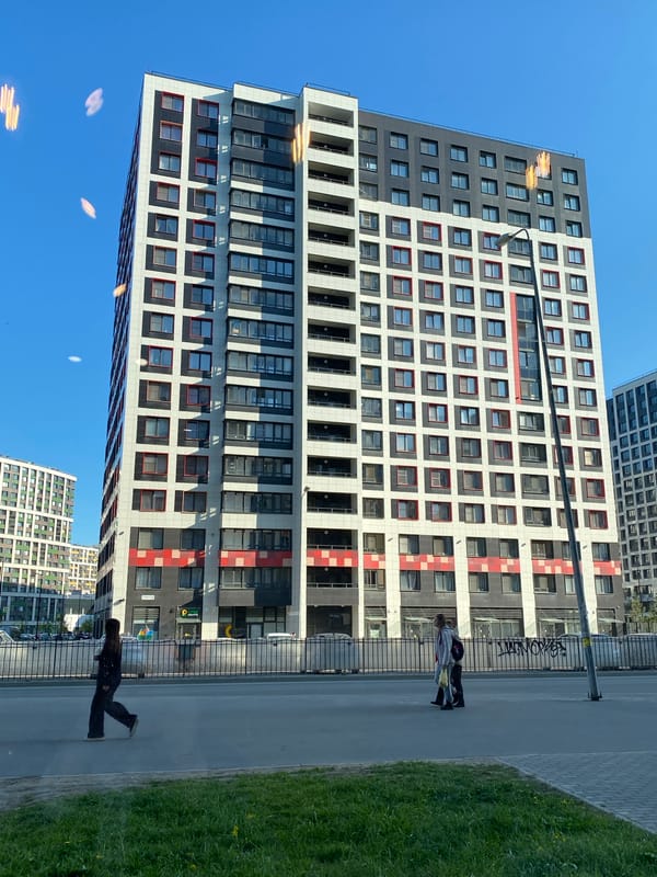 Resident documents modern Murino building and iPhone screen