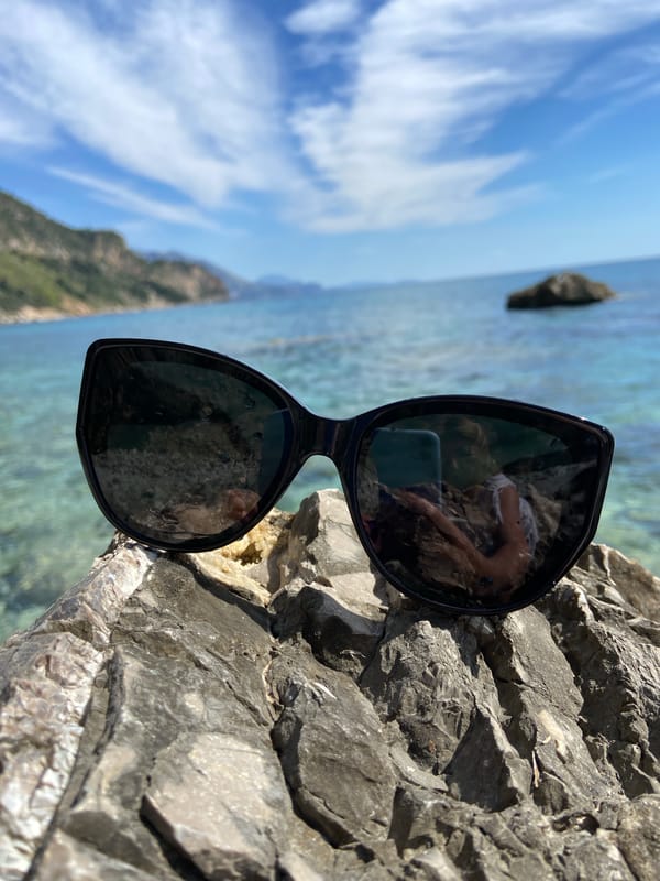 Woman relaxes on rocky Adriatic coast near Prijevor, Montenegro