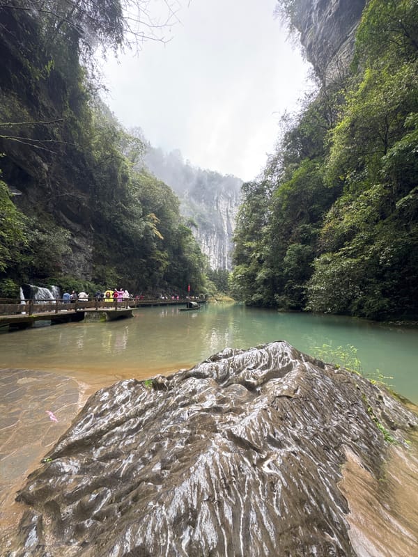 Scenic gorge and traditional boat captured in Wulong District
