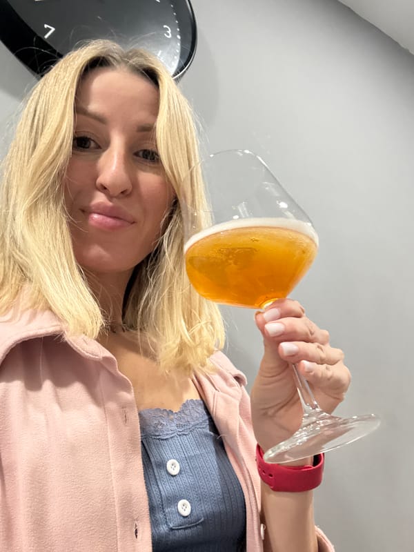 Woman enjoys beer indoors in València
