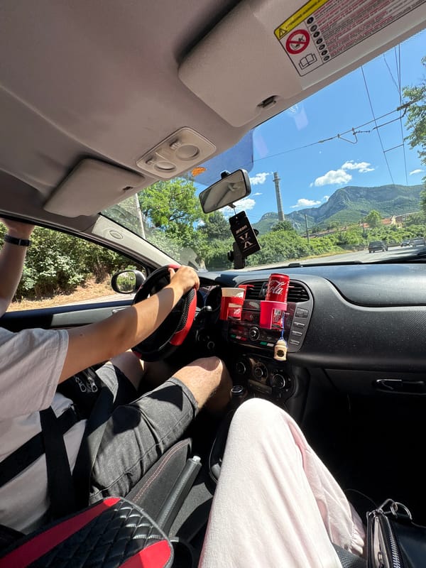Sunny drive through Vratsa, Bulgaria with mountain backdrop