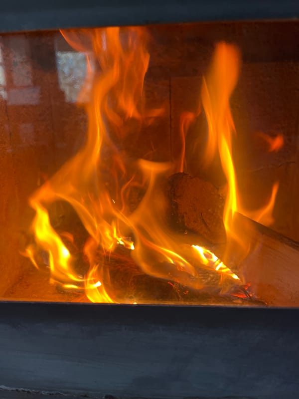 Wood-burning stove operates in Pchelnik, Bulgaria morning hours