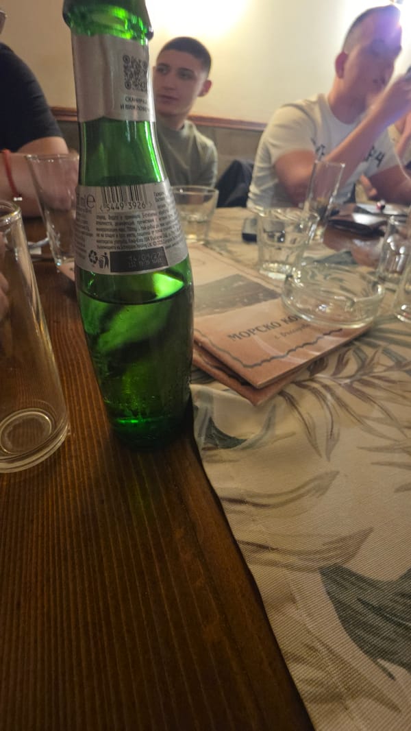 Green bottle with Bulgarian label spotted on table