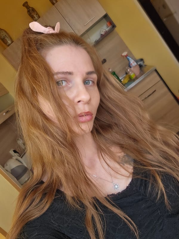 Woman photographs self in casual portrait in Gabrovo, Bulgaria
