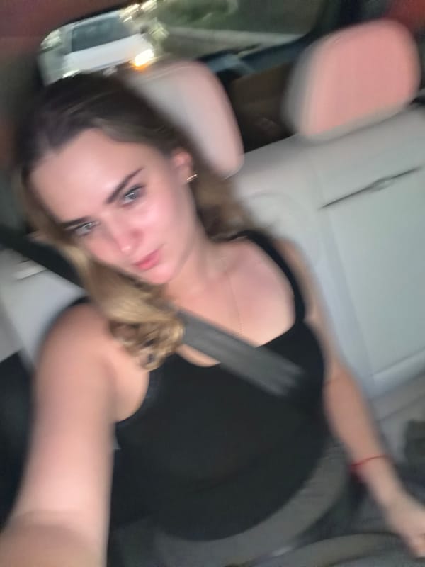 Person photographed reclining in car in Tlaxcalancingo, Mexico