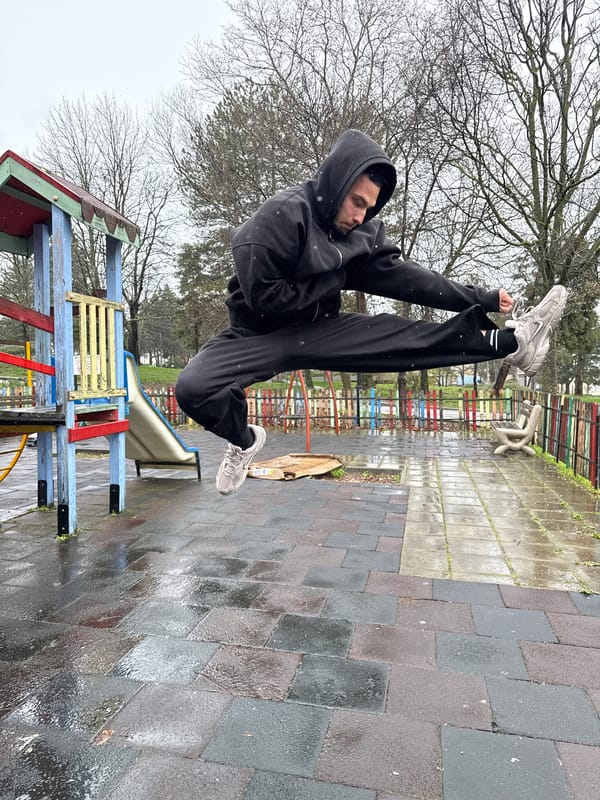 Person exercises and shelters at Shumen playground during overcast weather