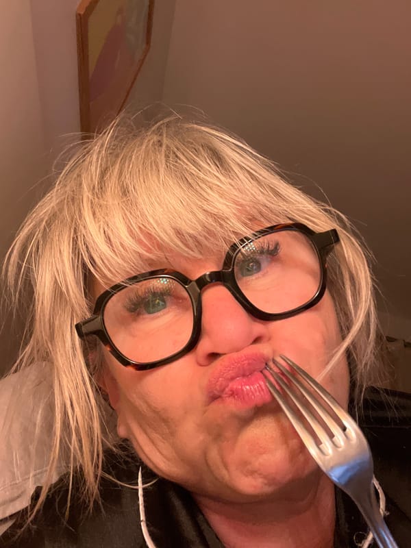 Woman collects scattered eggs from outdoor area in France