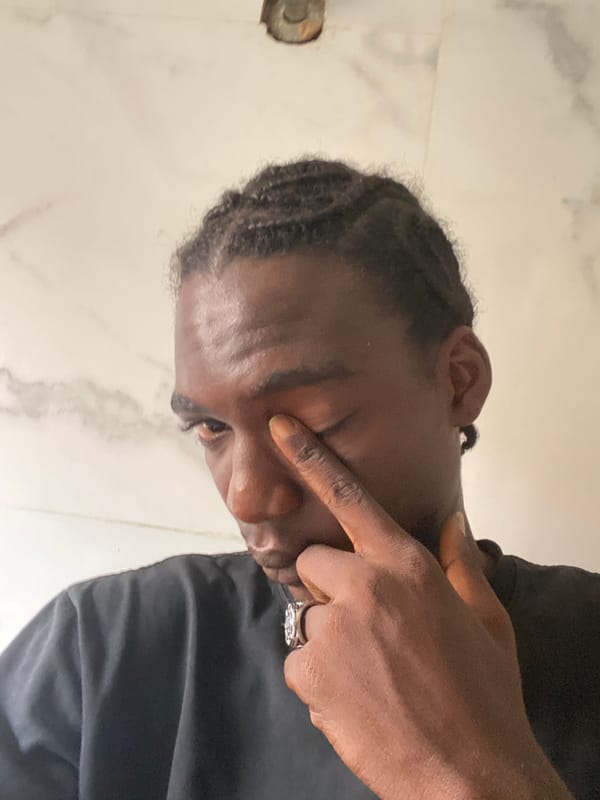 Person photographed multiple times in Lagos indoor setting