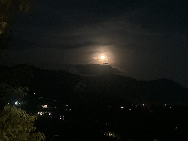 Bright moon observed through clouds over Baan Hin Kong