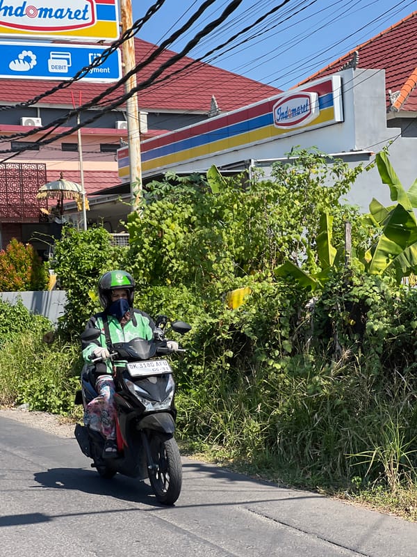 Morning motorcycle traffic observed on Denpasar roads