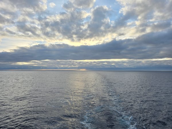 Cargo ship travels South Atlantic waters under cloudy skies