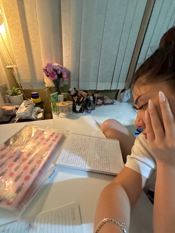 Student studies, takes selfies during homework session in Plovdiv