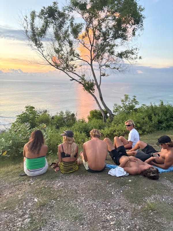Seven youth gather for clifftop sunrise viewing in Kuta Selatan