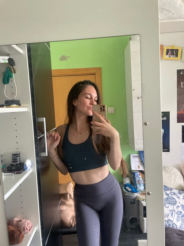 Woman takes mirror selfie in athletic wear in Sofia