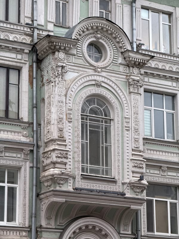 Vintage Buick spotted on wet Moscow streets near ornate architecture