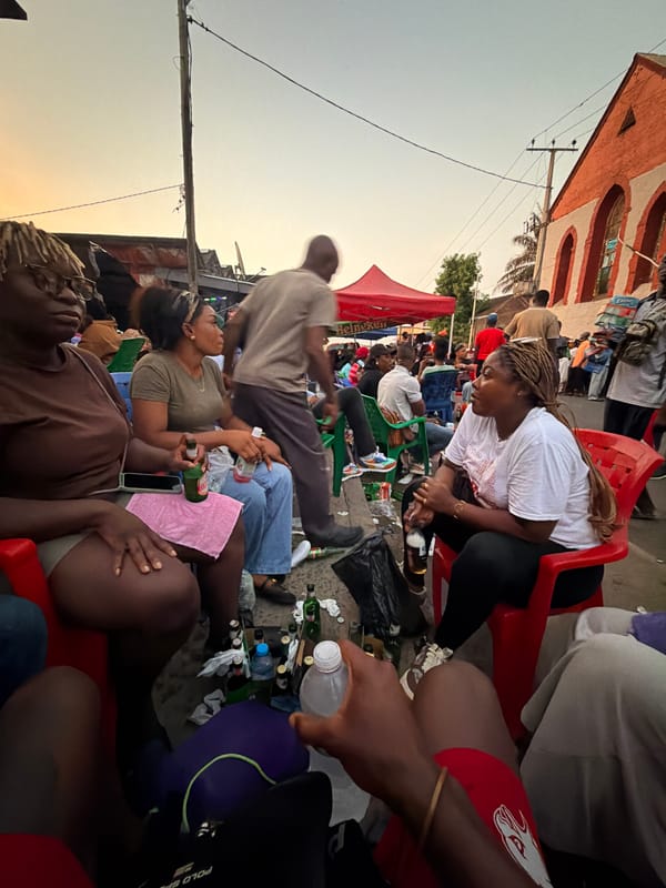 Outdoor beer gathering observed in Monrovia under Heineken tent