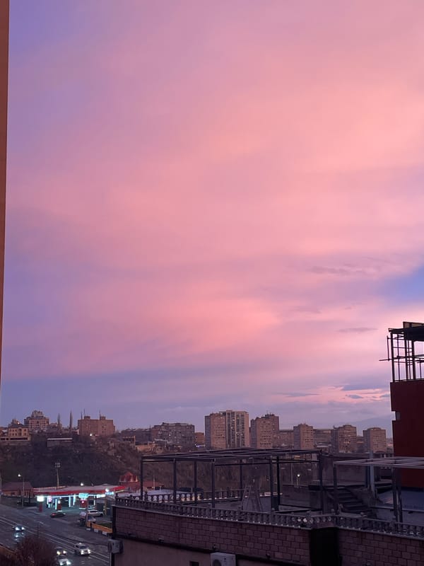 Vibrant pink-purple twilight sky observed over Yerevan, Armenia