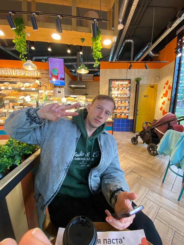 Man poses at Russian bakery during morning visit