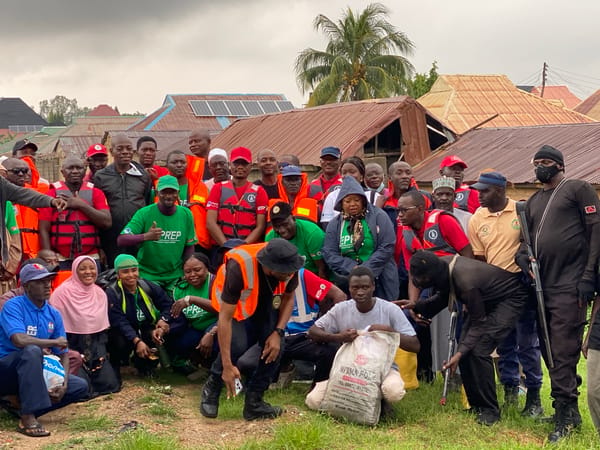 Armed and emergency personnel gather in Kawo, Nigeria