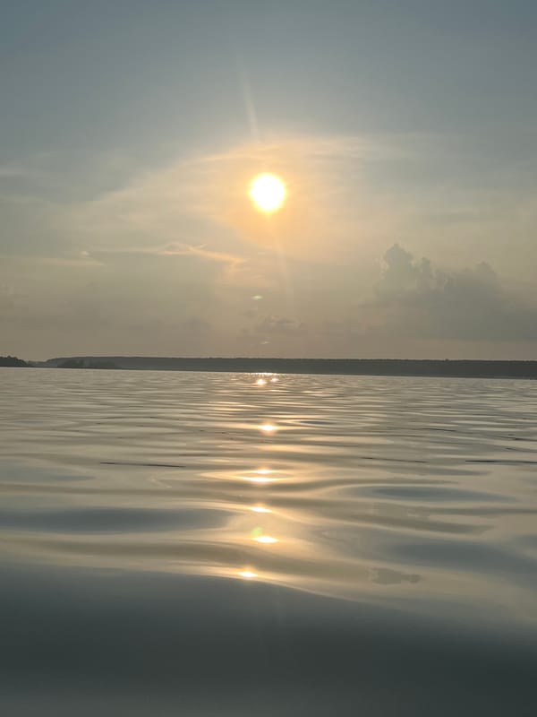 Hazy sunset over a lake outside Borovoe, Russia