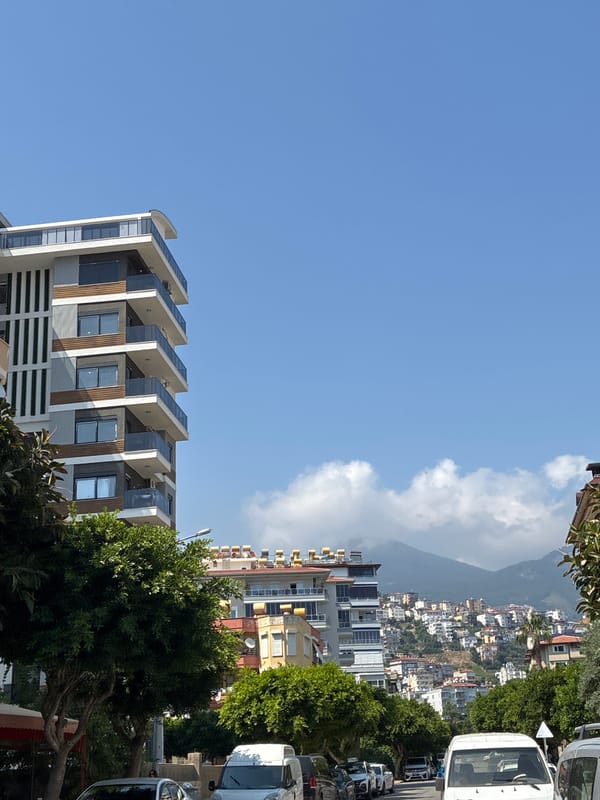 Tourist walks through Alanya capturing typical Mediterranean street life