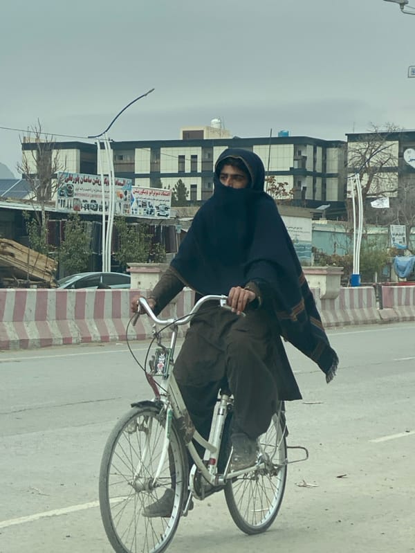 Morning street traffic observed in Kandahar under cloudy skies