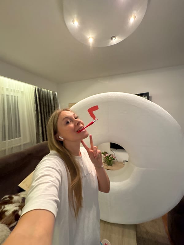 Party selfies and pink paint on a donut prop in Budva