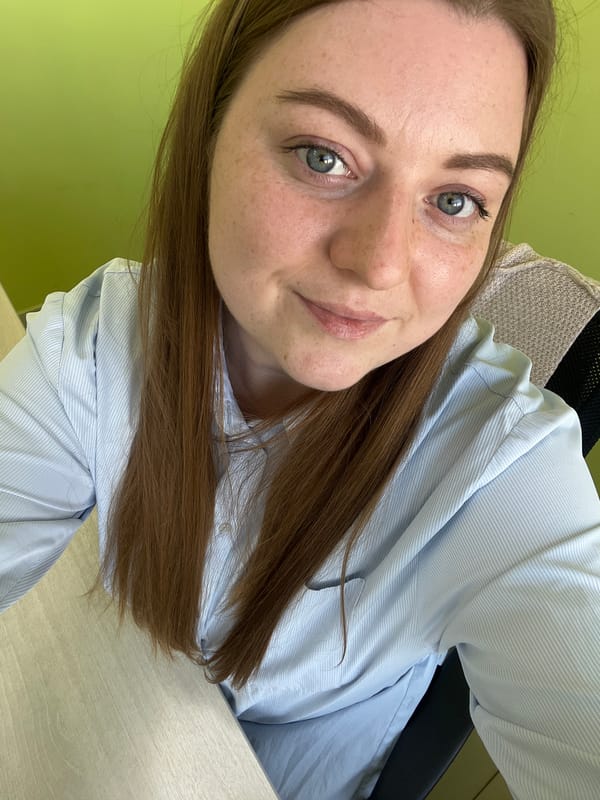 Office selfies and construction equipment activity in Klin, Russia