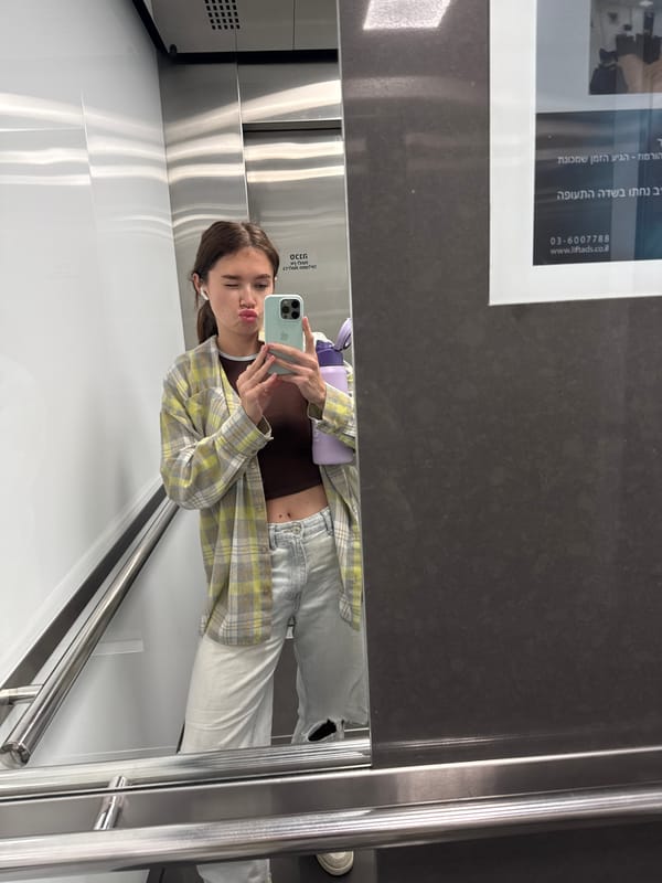 Woman takes selfies in elevator and vanity mirror in Ramat Gan