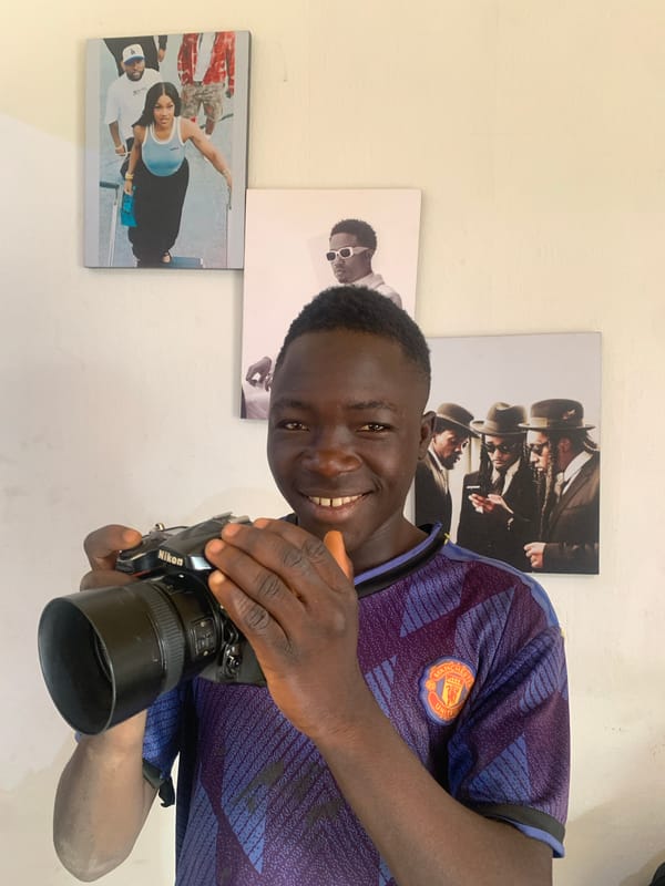Young photographer in Manchester United jersey captured in Jos