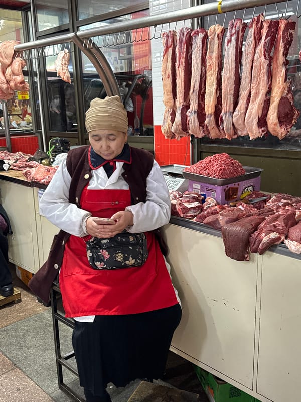 Morning market activity documented across Bishkek indoor bazaar stalls