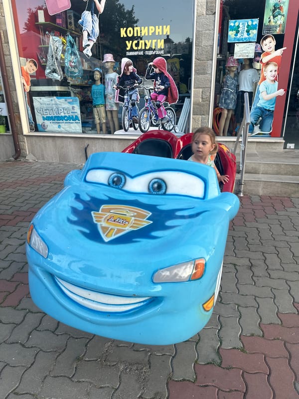 Cartoon car kiddie ride on a Tryavna street